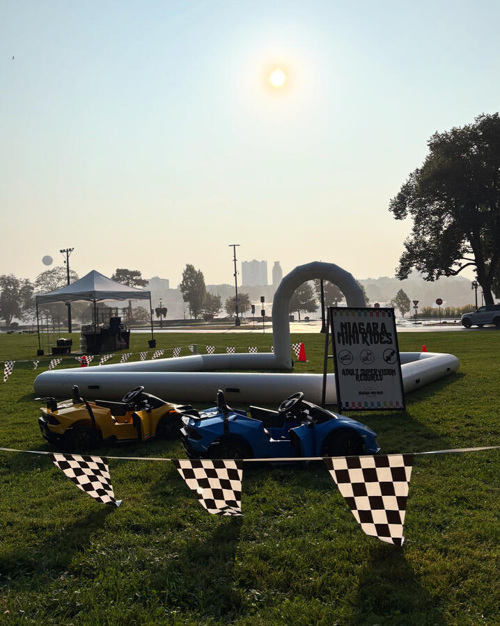 Niagara 5000 event. Complete bumper car and mini Lambo experience. Large outdoor setup featuring bumper cars and mini Lambo at a public park.